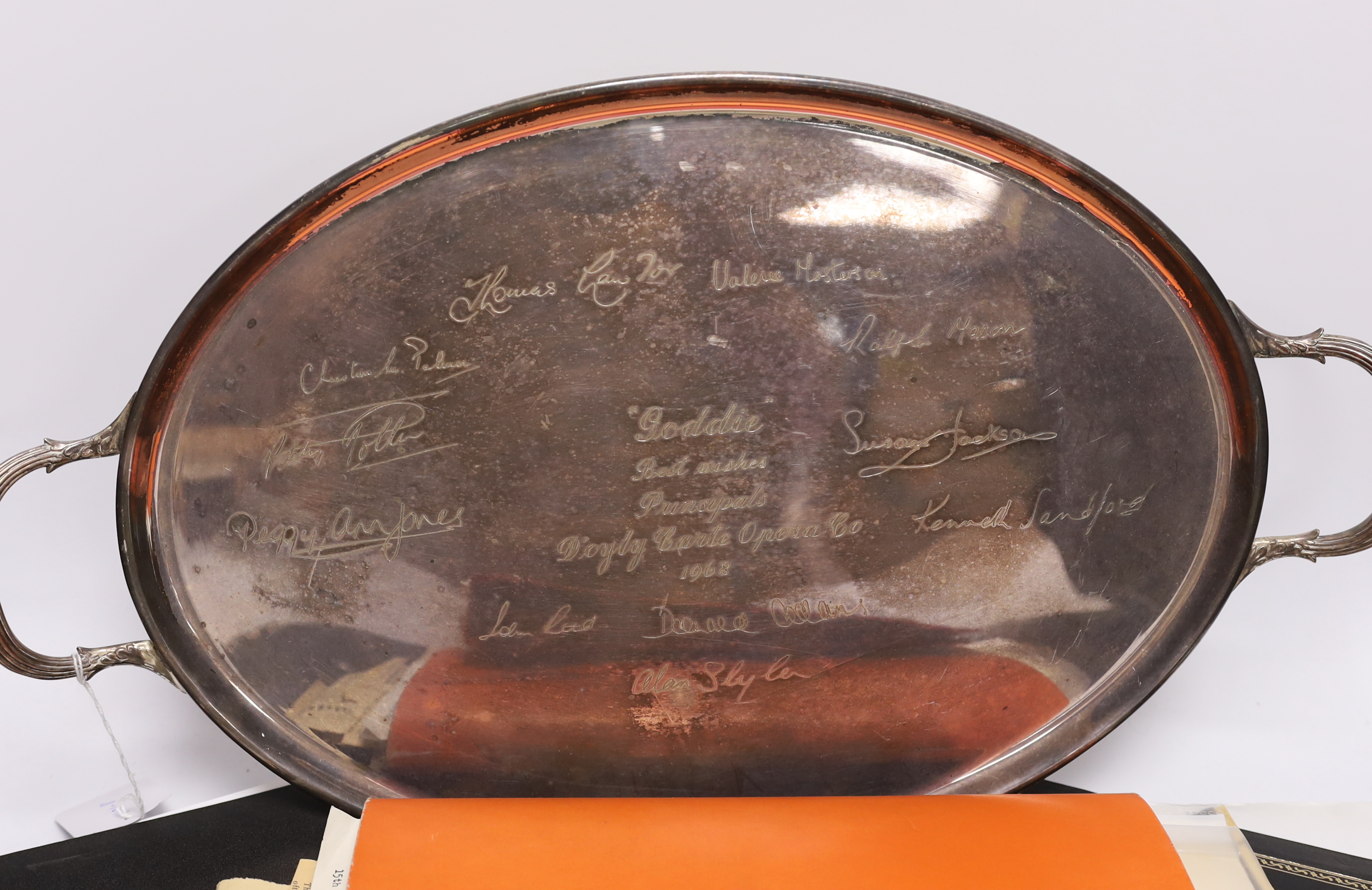 D’Oyly Carte interest; a silver plated tray with etched signatures of singers and principal artists of the D’Oyly Carte Opera Company, presented to Musical Director Isidore Godfrey on his retirement in 1968, together wit